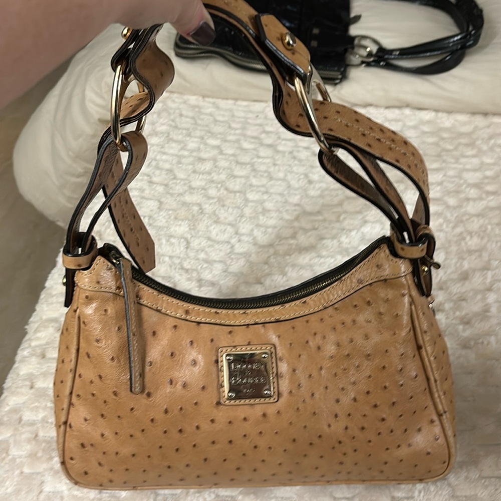 Dooney & Burke (vintage) eel skin.I have the matching wallet  (sold separately).